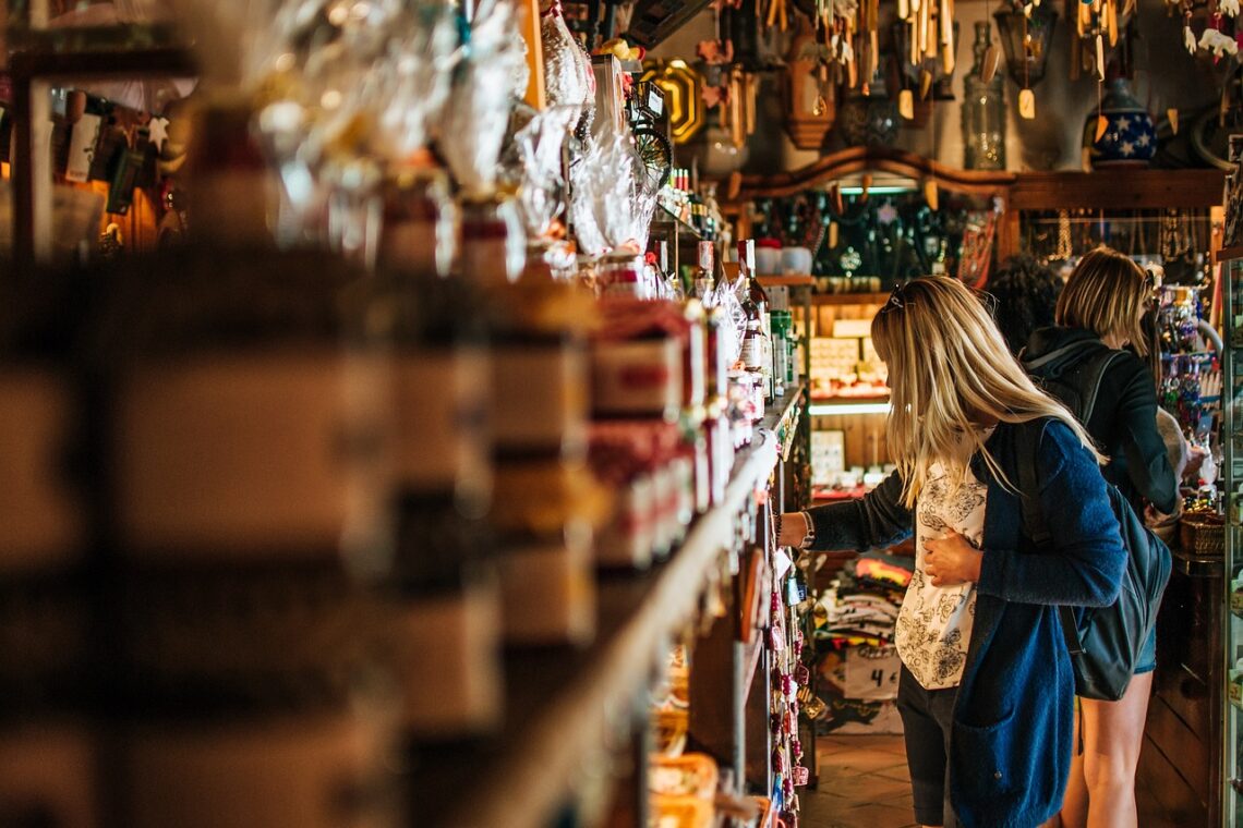 Girl looking at jars in a souvenir shop