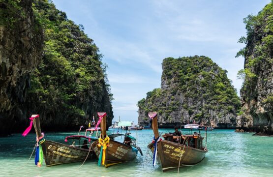Three boats docked on a beach resort in Phuket, Thailand