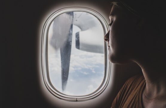 Woman sleeping on a plane by the window seat